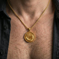 Load image into Gallery viewer, Gold plated oriental dragon medallion pendant necklace worn on the neck, lifestyle photo featuring warm tone finish and strong statement medallion presence.
