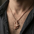 Load image into Gallery viewer, Rose gold plated Njord Norse sea god pendant necklace worn on the neck, lifestyle wear shot with elegant rosy shine and crisp rune-and-relief detailing visible.
