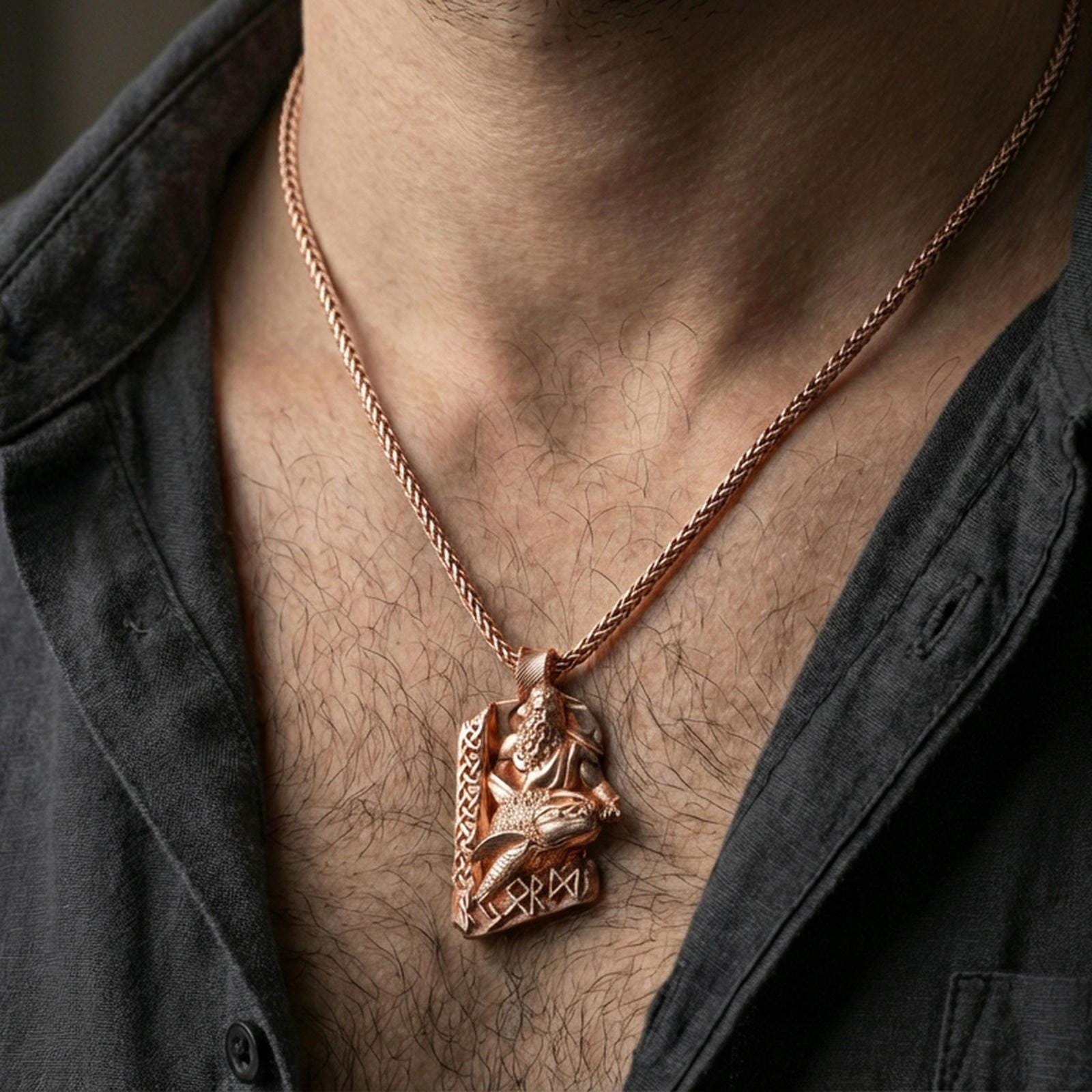 Rose gold plated Njord Norse sea god pendant necklace worn on the neck, lifestyle wear shot with elegant rosy shine and crisp rune-and-relief detailing visible.