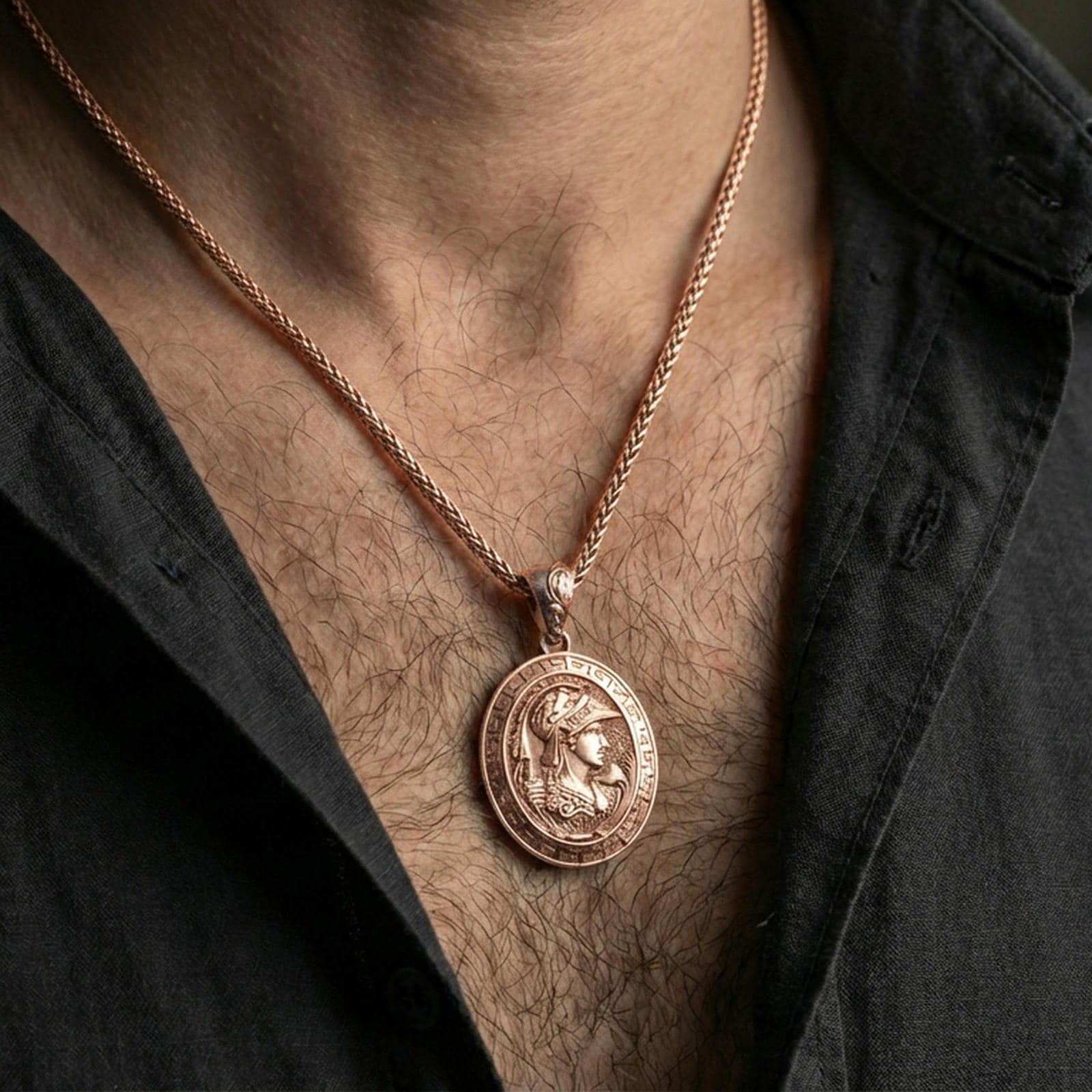 Rose gold plated Athena coin pendant necklace worn on the neck, lifestyle wear shot with elegant rosy shine and crisp Greek key border detailing visible.