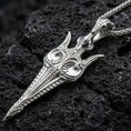 Load image into Gallery viewer, Polished silver Gungnir spear pendant necklace on textured volcanic rock, crisp macro product photo emphasizing clean edges, precise engraving, and bright reflective highlights along the blade.

