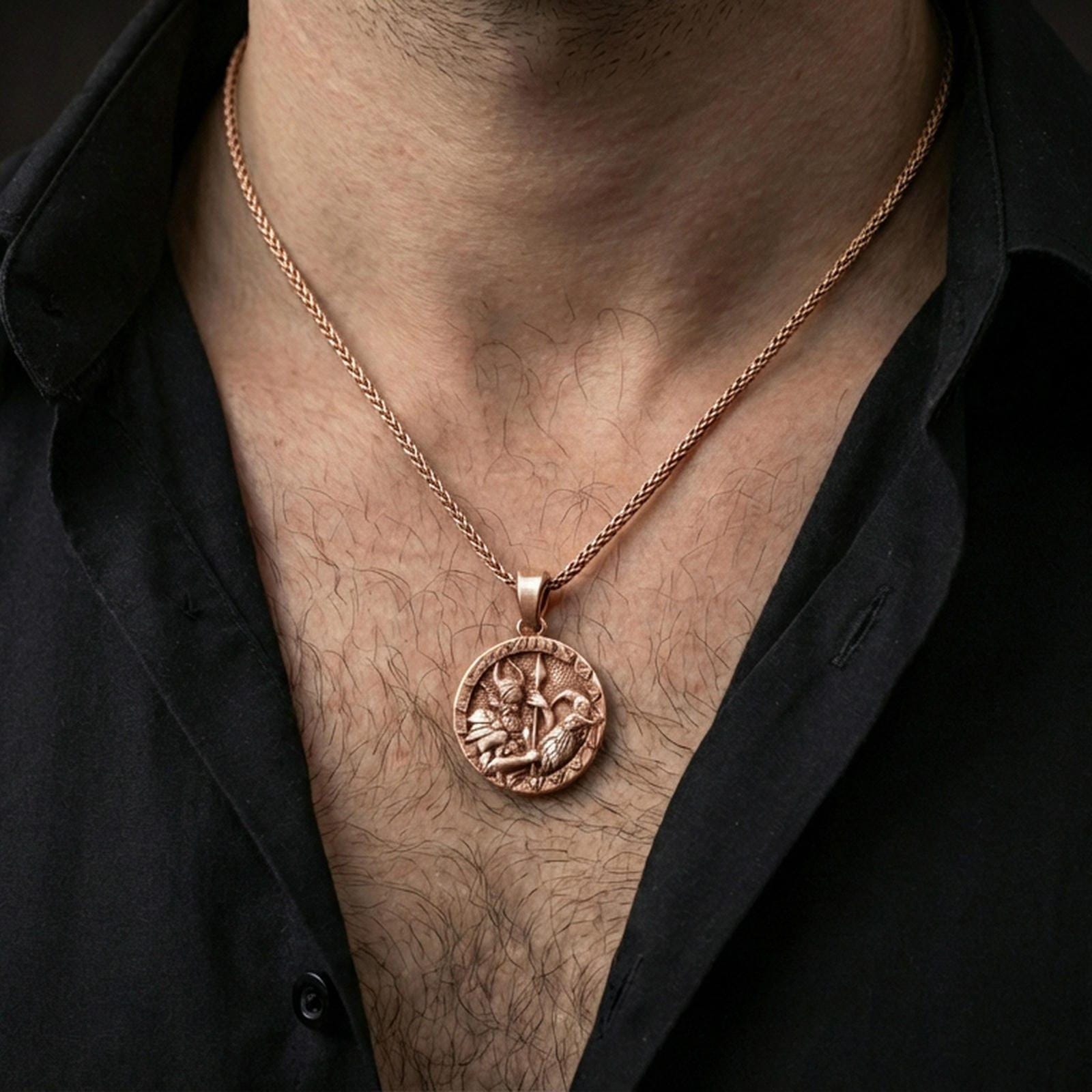 Rose gold plated Odin and raven medallion pendant necklace worn on the neck, lifestyle wear shot with elegant rosy shine and crisp warrior-and-raven engraving visible.