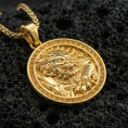 Load image into Gallery viewer, Gold plated imperial guardian lion pendant necklace on textured volcanic rock, premium close-up with warm reflective shine across the guardian lion portrait and the patterned border.

