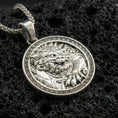 Load image into Gallery viewer, Polished silver imperial guardian lion pendant necklace on textured volcanic rock, crisp macro product photo emphasizing bright reflections, clean edges, and sharp relief detailing on the lion’s mane and claws.

