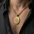Load image into Gallery viewer, Gold plated oval saint necklace with lion companion and scripture detail worn on the neck in a premium lifestyle composition with classic devotional jewelry styling
