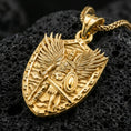 Load image into Gallery viewer, Gold plated Archangel Michael necklace with protective shield design, armored angel figure, and detailed wings showcased on black volcanic rock in a refined macro jewelry image
