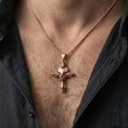 Load image into Gallery viewer, Rose gold plated skull cross necklace worn on the neck in a refined lifestyle shot with a bold and distinctive gothic presentation
