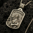 Load image into Gallery viewer, Bronze Saint Gabriel pendant with angelic figure, wing detail, and ST Gabriel inscription displayed on dark volcanic rock in a close-up luxury jewelry composition
