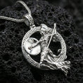 Load image into Gallery viewer, Polished silver Athena warrior pendant necklace on textured volcanic rock, crisp macro product photo emphasizing clean edges, sharp relief detailing on the shield and spear, and bright reflective highlights.
