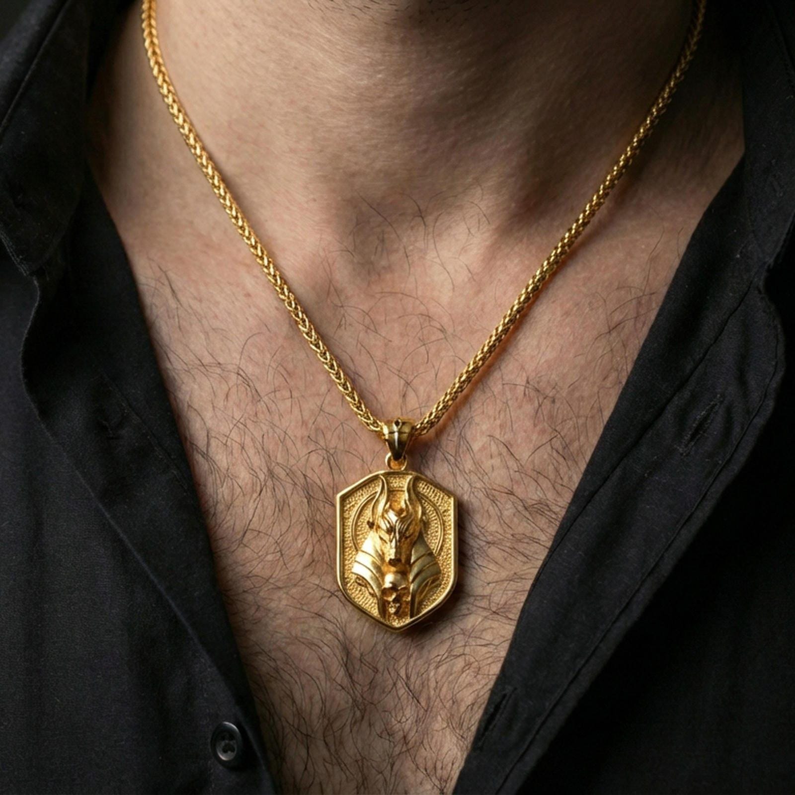 Gold plated Anubis pendant necklace worn on the neck, lifestyle photo featuring warm tone finish and strong statement pendant presence.