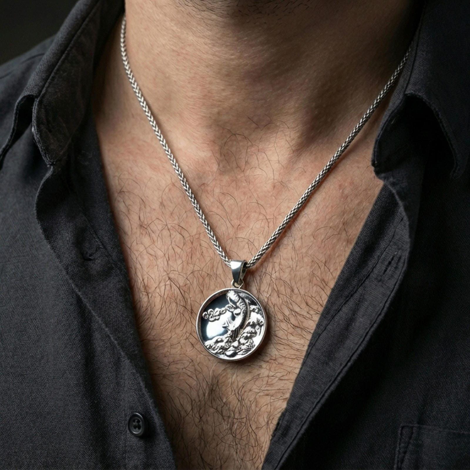 Polished silver koi fish medallion pendant necklace worn on the neck, clean lifestyle wear shot capturing bright shine and the detailed koi relief in natural light.