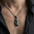 Load image into Gallery viewer, Oxidized Viking warrior head pendant necklace worn on the neck, lifestyle framing showing realistic scale and bold vintage contrast against the chest.
