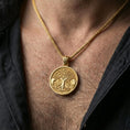 Load image into Gallery viewer, Gold plated Yggdrasil tree of life pendant necklace worn on the neck, lifestyle photo featuring warm tone finish and strong statement medallion presence.
