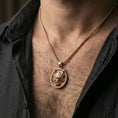 Load image into Gallery viewer, Rose gold plated demon mask medallion pendant necklace worn on the neck, lifestyle wear shot with elegant rosy shine and crisp demon mask detailing visible.
