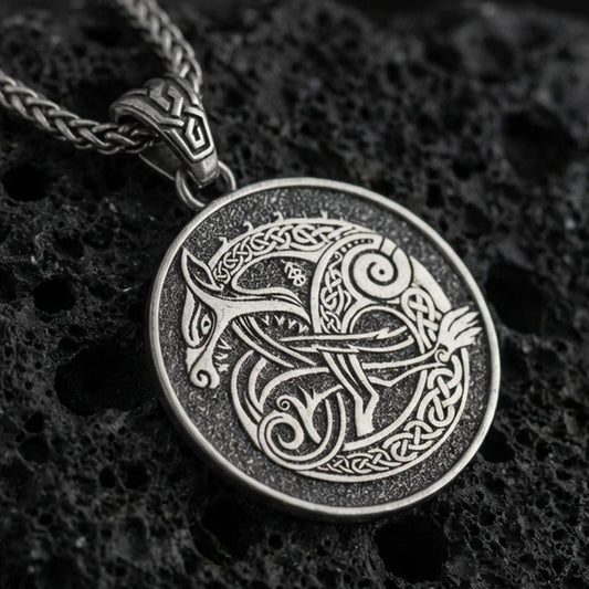 Oxidized Urnes style Viking beast pendant necklace on textured volcanic rock, centered close-up highlighting the interlaced Norse animal motif, braided knotwork, and deep antique shadowed contrast.