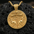 Load image into Gallery viewer, Gold plated Viking deer medallion pendant necklace on textured volcanic rock, premium close-up with warm reflective shine across the twin deer figures, ornate knotwork, and raised circular frame.
