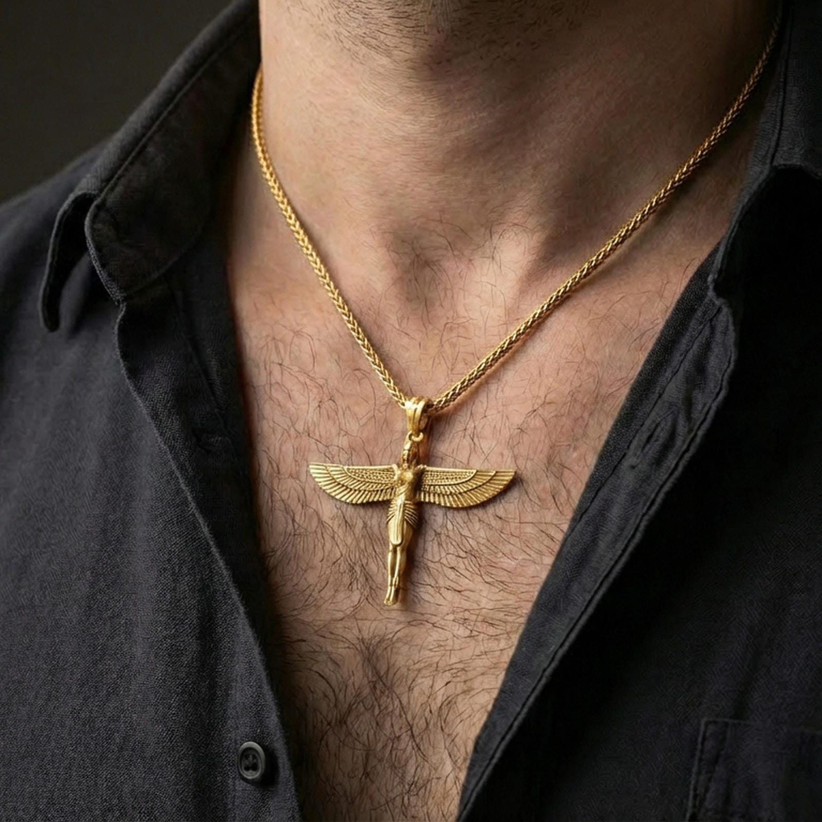 Gold plated winged Isis goddess pendant necklace worn on the neck, lifestyle photo featuring warm tone finish and strong statement pendant presence.