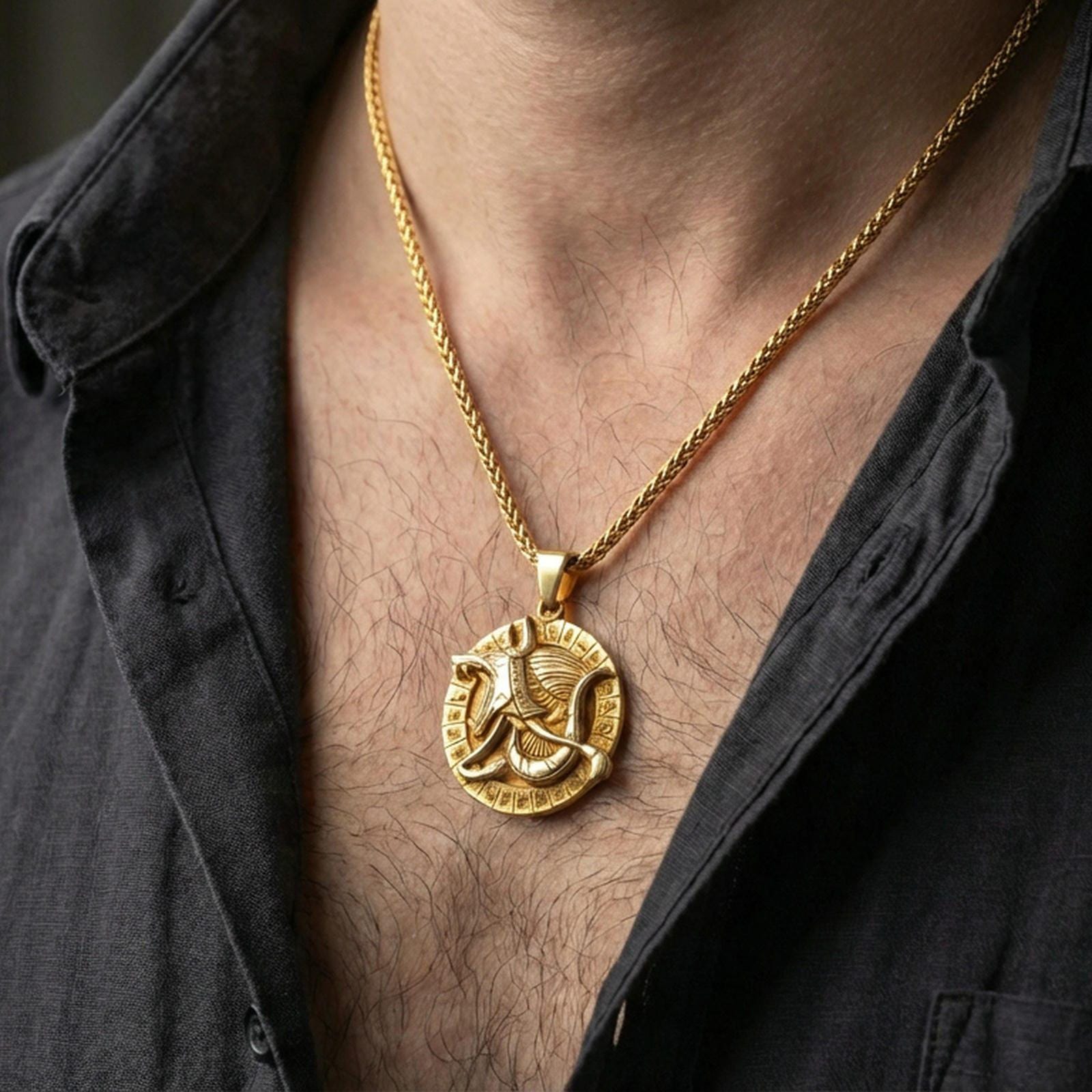 Gold plated Anubis medallion pendant necklace worn on the neck, lifestyle photo featuring warm tone finish and strong statement Egyptian talisman presence.