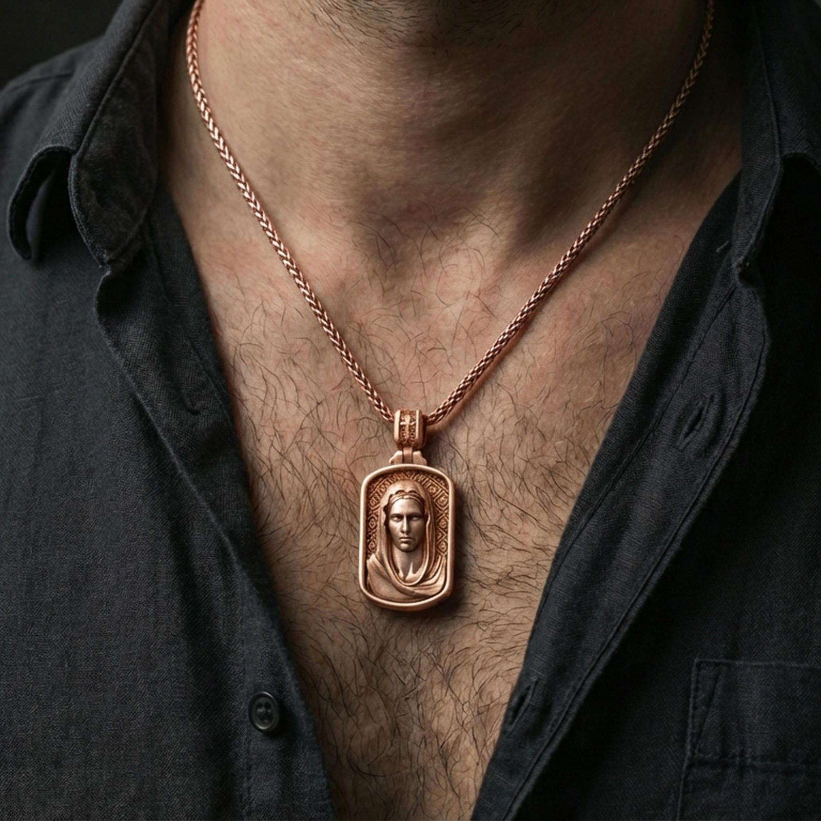 Rose gold plated Madonna pendant with veiled devotional figure worn on the neck in a refined lifestyle shot with a warm and elegant presentation