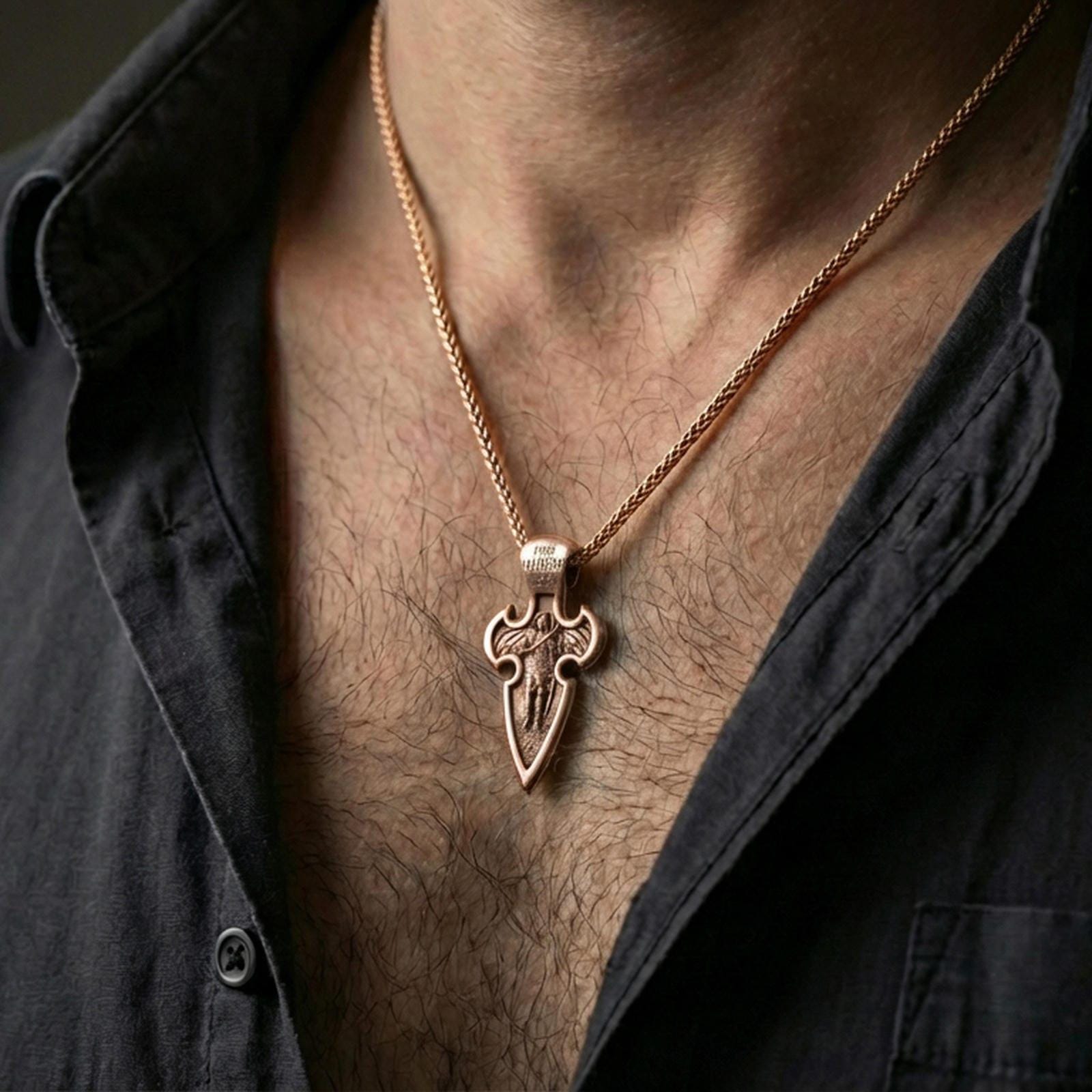 Rose gold plated Archangel Michael cross pendant with sacred warrior relief and elongated gothic form worn on the neck in a refined lifestyle shot with a warm and powerful presentation