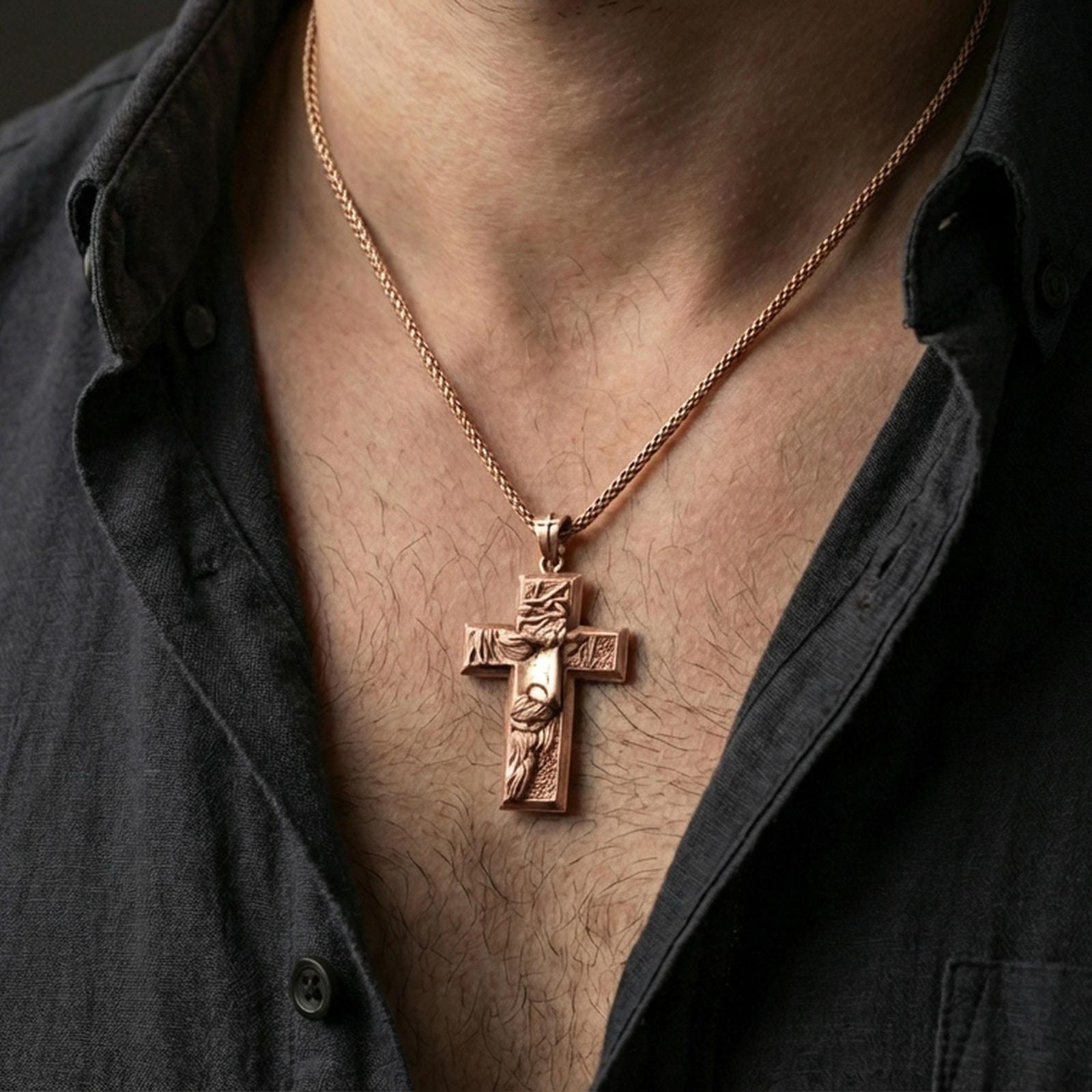 Rose gold plated religious cross pendant with sculpted Jesus figure worn on the neck in a refined lifestyle shot with a warm and elegant presentation