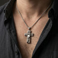 Load image into Gallery viewer, Oxidized Jesus cross pendant with crucifix figure worn on the neck in a lifestyle jewelry shot, styled against the chest for a bold and devotional look
