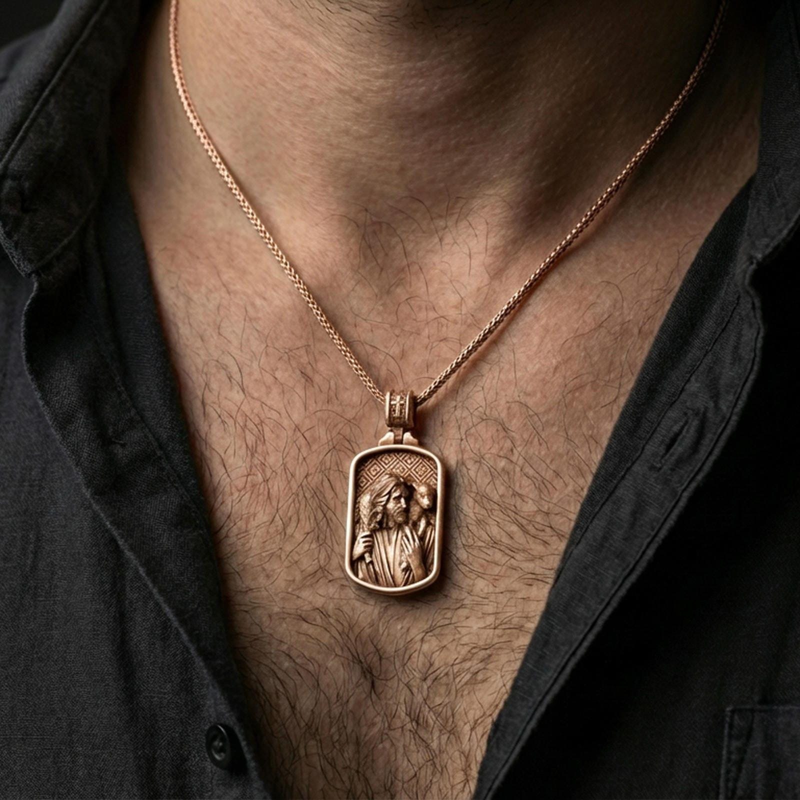 Rose gold plated religious Jesus pendant with shepherd figure and lamb over the shoulders worn on the neck in a refined lifestyle shot with a warm and elegant presentation
