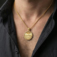 Load image into Gallery viewer, Gold plated religious pendant with Last Supper relief and engraved prayer reverse worn on the neck in a premium lifestyle composition with classic Christian jewelry styling

