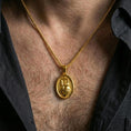 Load image into Gallery viewer, Gold plated Sacred Heart necklace with cross and flame motif worn on the neck in a premium lifestyle composition with timeless Christian jewelry styling
