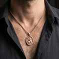 Load image into Gallery viewer, Rose gold plated Saint Jude pendant with devotional portrait and medallion detail worn on the neck in a refined lifestyle shot with a warm and elegant presentation

