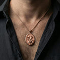Load image into Gallery viewer, Rose gold plated Saint Christopher pendant with Child Jesus and staff detail worn on the neck in a refined lifestyle shot with a warm and elegant presentation
