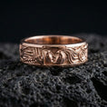 Load image into Gallery viewer, Rose gold plated lovers face ring on volcanic stone, refined close-up featuring soft rose highlights on the couple relief and ornamental flowing hair lines.

