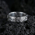 Load image into Gallery viewer, Polished silver geometric circle pattern ring on volcanic stone, clean product shot emphasizing smooth shine and crisp circular engraving depth.
