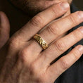 Load image into Gallery viewer, Oxidized sterling silver geometric circle pattern ring worn on a finger, lifestyle wear photo showing bold contrast and the repeating circular motif in natural light.

Polished silver geometric circle pattern ring worn on a finger, lifestyle image capturing bright reflective finish and the sculpted circle pattern as a modern band.

Gold plated geometric circle pattern ring worn on a finger, lifestyle shot emphasizing luxurious gold tone and the clean concentric design as a statement ring.
