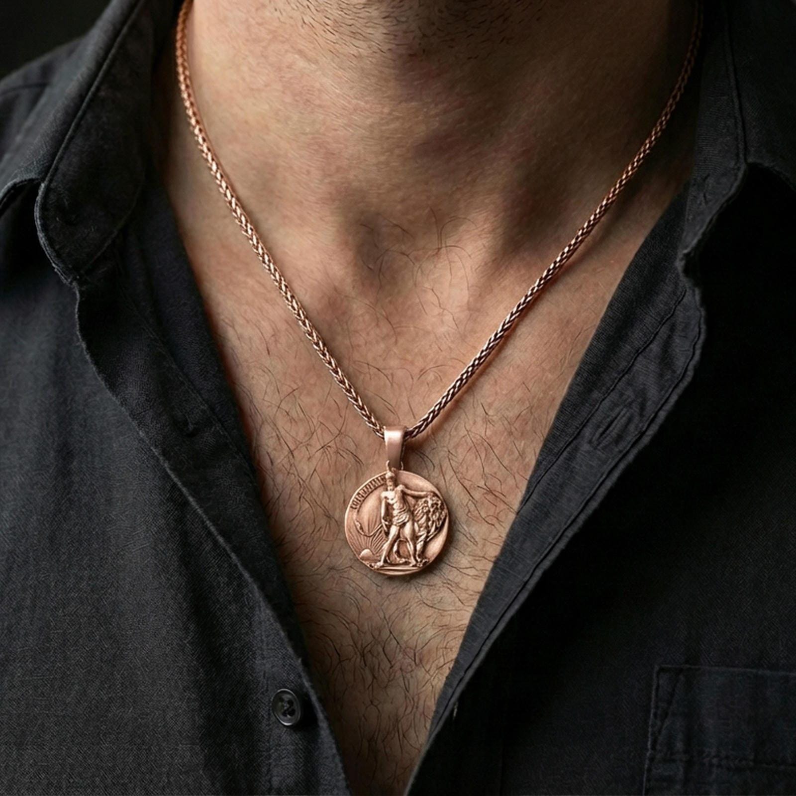 Rose gold plated Lion of Judah pendant with lion figure and round devotional form worn on the neck in a refined lifestyle shot with a warm and powerful presentation