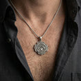 Load image into Gallery viewer, Oxidized heart chakra pendant with sacred symbol worn on the neck in a lifestyle jewelry shot, styled against the chest for a bold and spiritual look
