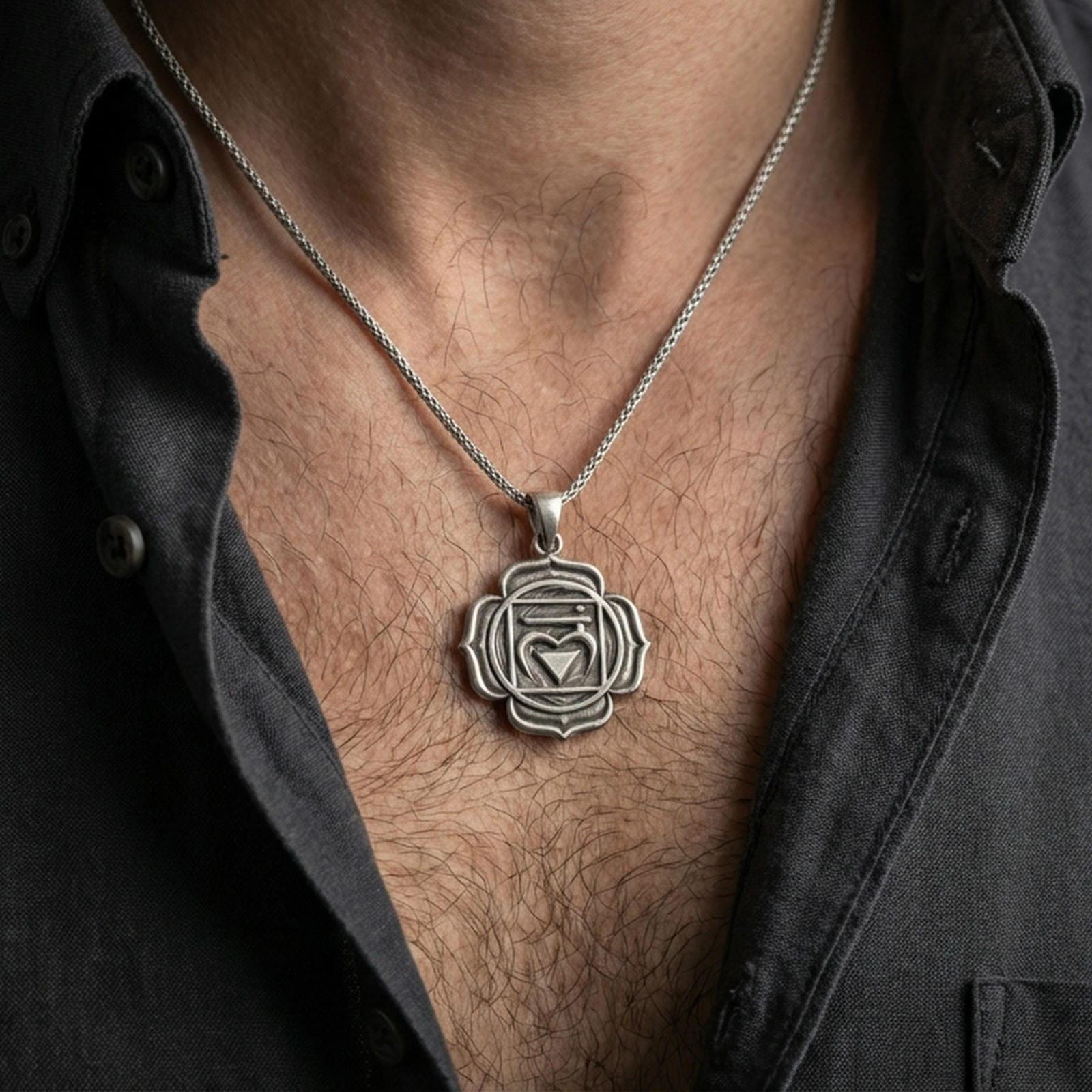 Oxidized heart chakra pendant with sacred symbol worn on the neck in a lifestyle jewelry shot, styled against the chest for a bold and spiritual look