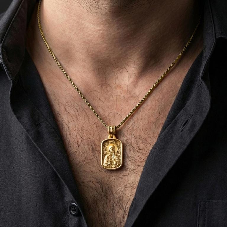 Gold plated Saint Anastasia necklace with framed saint icon and cross detail worn on the neck in a premium lifestyle composition with classic Christian jewelry styling