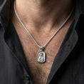 Load image into Gallery viewer, Polished silver Saint Anastasia medallion with orthodox icon relief worn on the neck in a close lifestyle frame, highlighting the saint portrait and detailed sacred background
