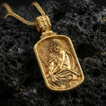 Load image into Gallery viewer, Gold plated Jesus Christ pendant with crown of thorns, draped robe detail, and sacred framed portrait showcased on black volcanic rock in a refined macro jewelry image
