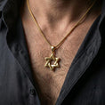 Load image into Gallery viewer, Gold plated Star of David pendant with geometric six-pointed star form worn on the neck in a premium lifestyle composition with timeless spiritual jewelry styling

