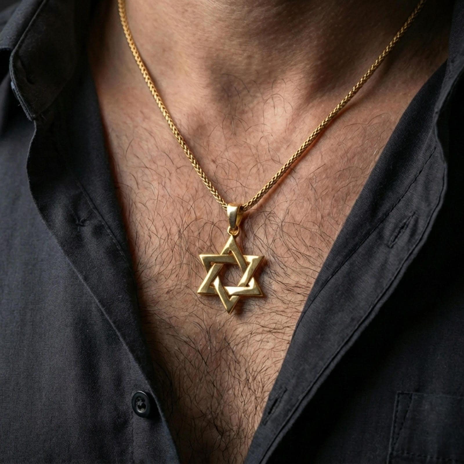 Gold plated Star of David pendant with geometric six-pointed star form worn on the neck in a premium lifestyle composition with timeless spiritual jewelry styling