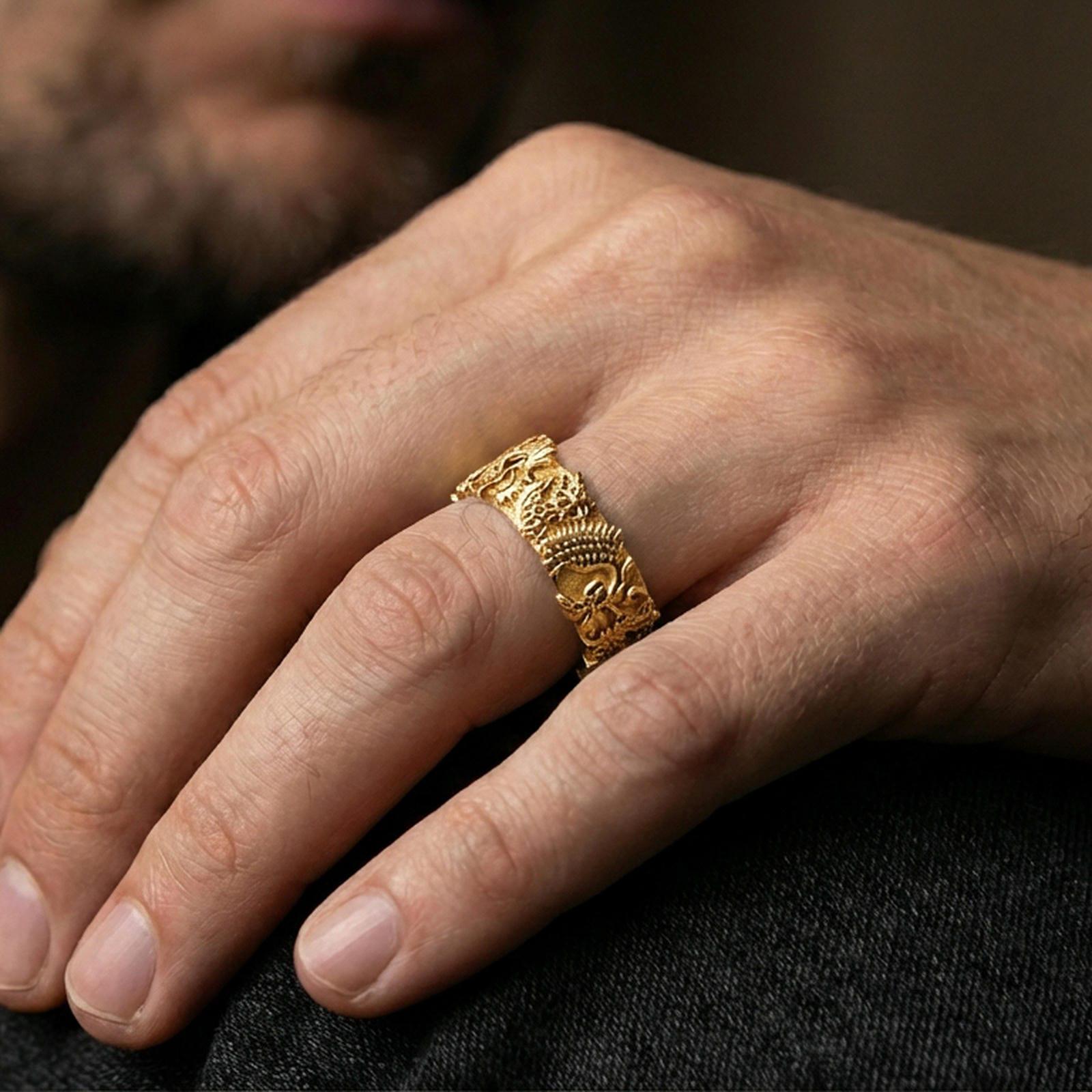 Gold plated Japanese dragon band ring worn on the finger, lifestyle wear shot emphasizing luxurious gold tone, high-relief dragon detailing, and premium presence.