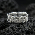 Load image into Gallery viewer, Polished silver Japanese dragon band ring on volcanic stone, macro shot highlighting crisp relief, refined edges, and bright reflective finish.
