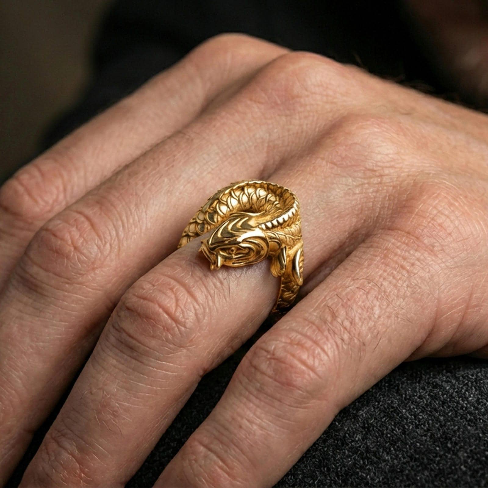 Gold plated koi fish wrap ring worn on the finger, lifestyle wear shot emphasizing luxurious gold tone, textured scales, and gift-ready presence.