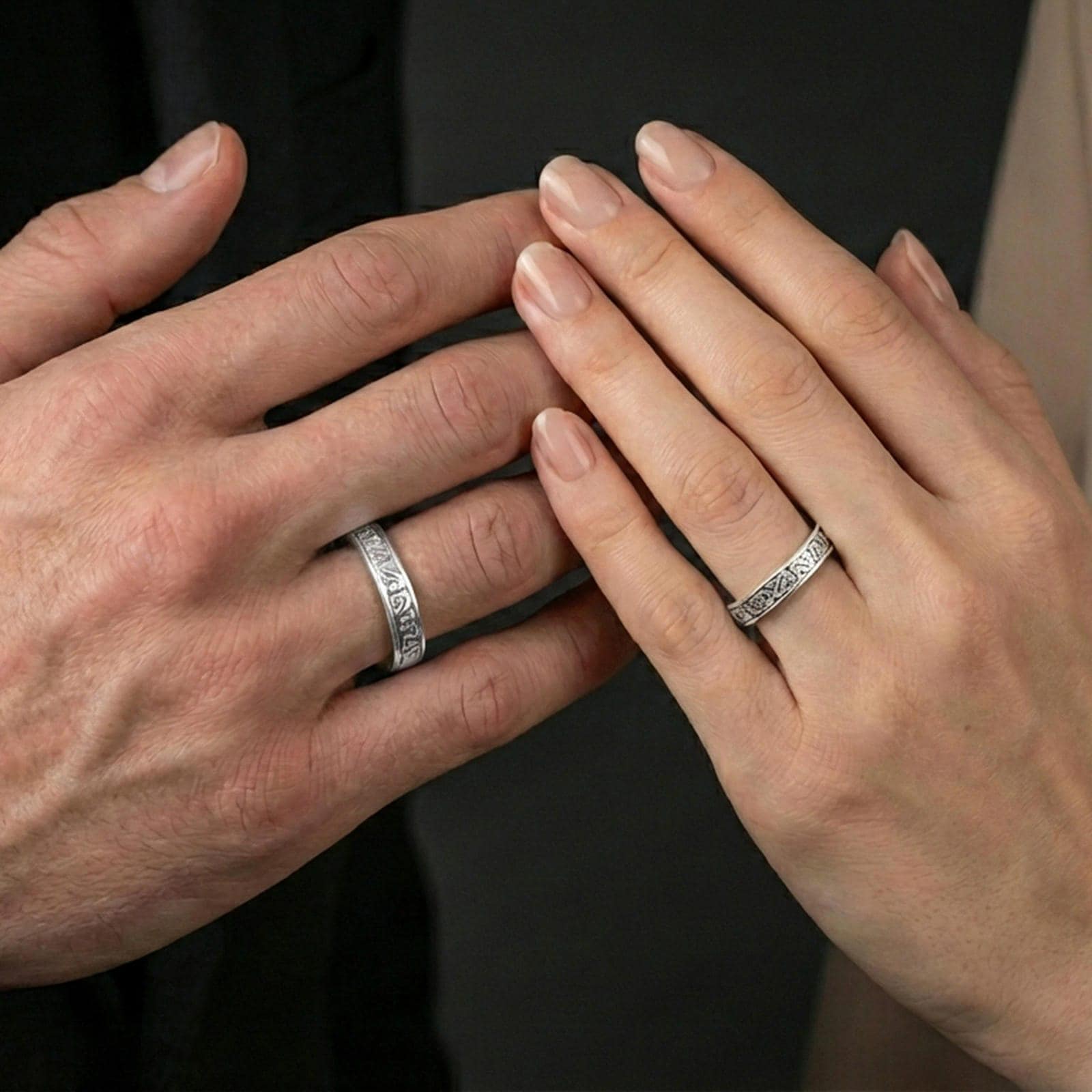 Polished silver Celtic knot band ring worn on the finger, lifestyle shot highlighting bright finish, everyday wear comfort, and sharp pattern depth.