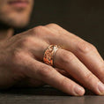 Load image into Gallery viewer, Rose gold plated koi fish band ring worn on the finger, lifestyle image showcasing refined rose tone, intricate koi texture, and modern stacking appeal.

