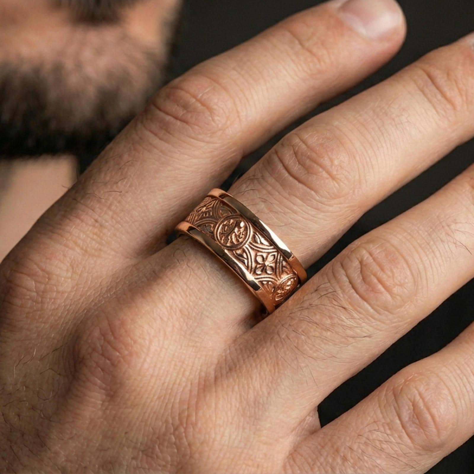 Rose gold plated spinner ring worn on the finger, lifestyle image showing elegant rose tone, detailed Celtic texture, and premium finish for daily wear.