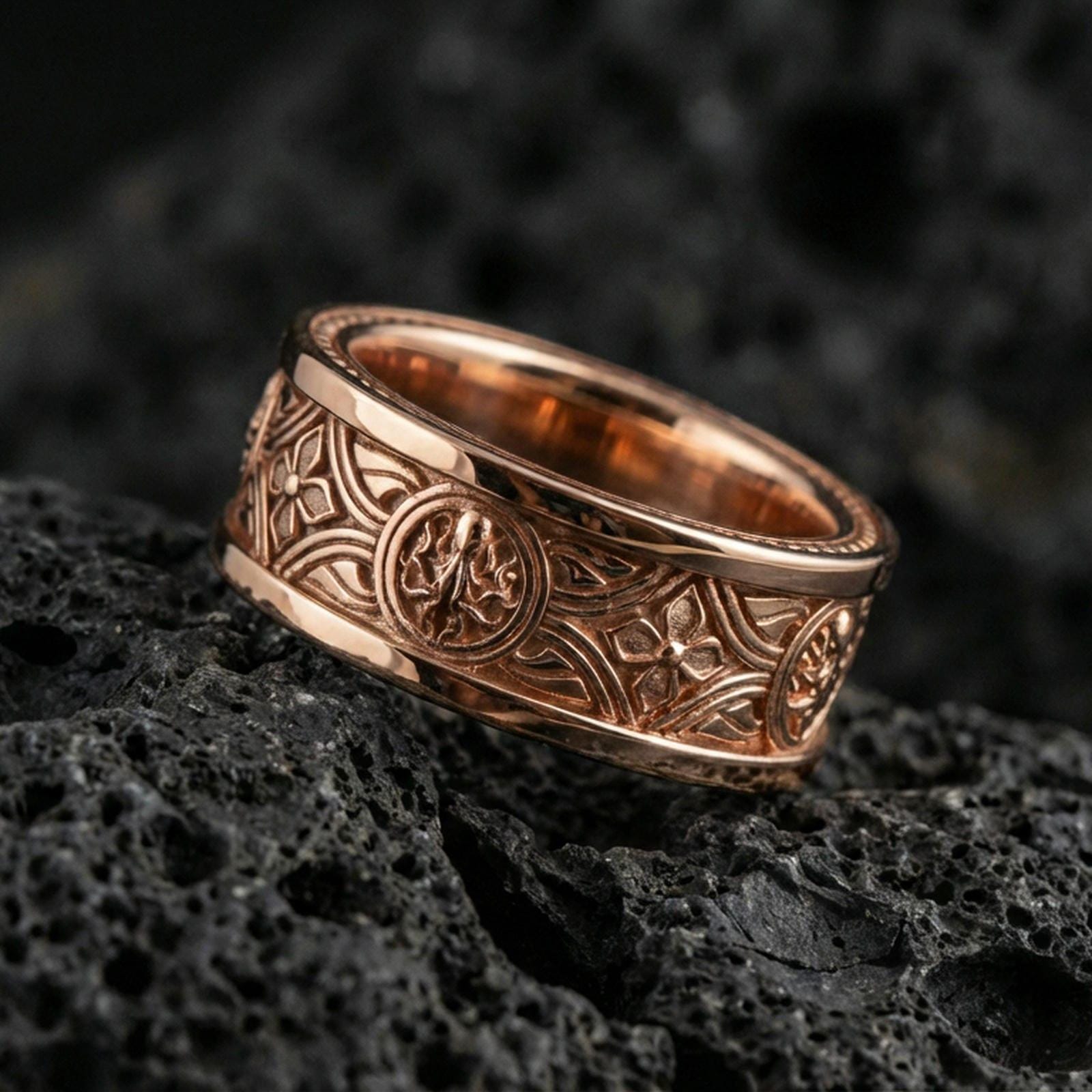 Rose gold plated spinner ring on volcanic stone, refined macro close-up showcasing soft rose reflections, raised round accents, and sculpted knotwork lines.