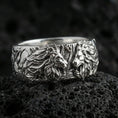Load image into Gallery viewer, Polished silver lion head ring on volcanic stone, crisp macro photo emphasizing bright reflections, sharp facial detail, and clean band edges.
